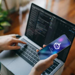 Asian woman using  AI chatbot virtual assistance app on smartphone to assist her while working on laptop. Using AI technology while working at home. Online robot system. Concept of VR and AR technologies. People, AI, innovation and technology